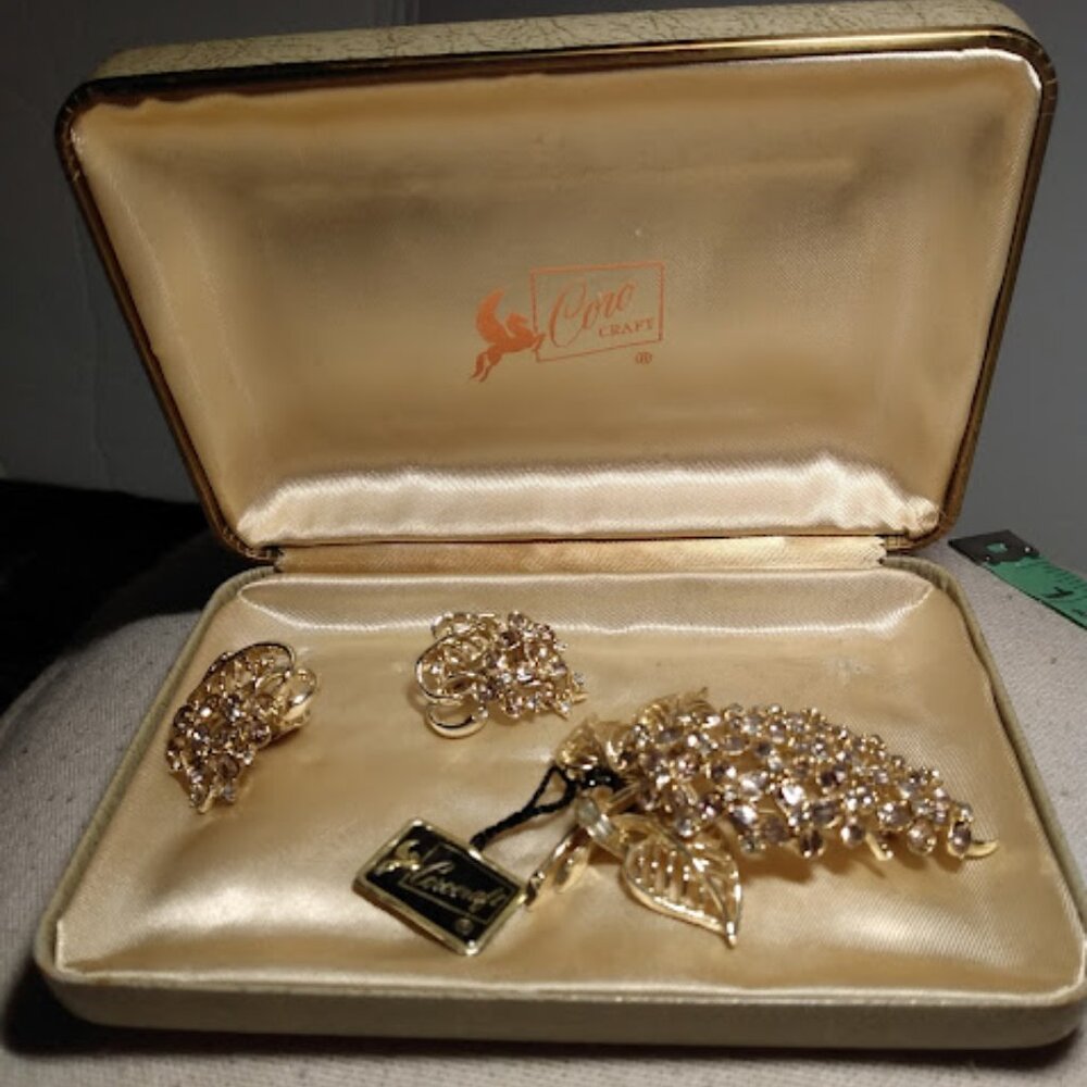 Coro craft  :Gold tone & rhinestone brooch with matching clip earrings.
